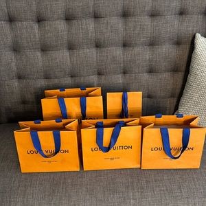 Louis Vuitton shopping bags.  Set of 5